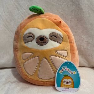 Squishmallow Simon The Sloth in Orange costume